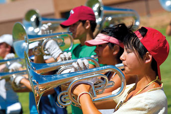 The brass section of the Santa Clara Vanguard rehearses on Monday at Thoreau High School. The drum and bugle corp marching band is traveling from California to Texas and needed a space to rehearse in between destinations. © 2011 Gallup Independent / Brian Leddy 